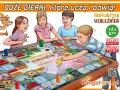 Dzieci grają w planszówkę o profilaktyce uzależnień. To jedna z tych gry o Polsce, które uczą i bawią.
