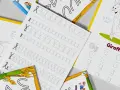 Zeszyty do pisania klasa 1. Ćwiczenia pisania liter i rysunki zwierząt, idealne dla dzieci.