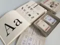Gra "SY-LA-BY" do nauki czytania dla 7 latka. Książka z literą "A" i kartami do nauki sylab.