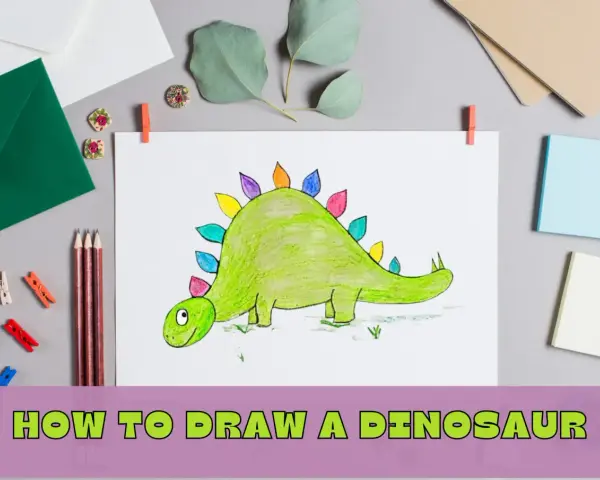 Kolorowy dinozaur na rysunku, obok kredki i kopert. Podpis "Jak narysować dinozaura" sugeruje instrukcję.